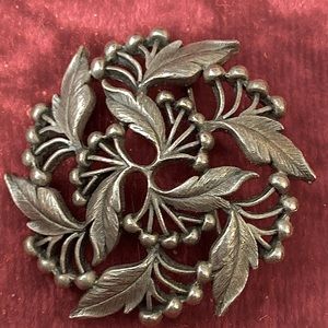 Vintage brooch pin. Simple, swirling elegance.
